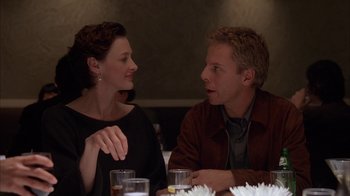 Movie still from “Friends with Money” (2006), directed by Nicole Holofcener – A man and a woman sitting at a dinner table; Close Up shot, Over the shoulder angle