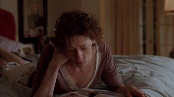 Movie still from “Friends with Money” (2006), directed by Nicole Holofcener – A woman is reading a magazine on a bed; Close Up shot, High angle