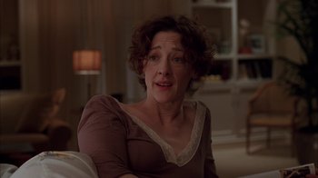 Movie still from “Friends with Money” (2006), directed by Nicole Holofcener – A person sitting in a chair; Close Up shot, Over the shoulder angle