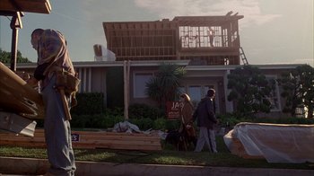 Movie still from “Friends with Money” (2006), directed by Nicole Holofcener – A couple of people walking down a sidewalk; Wide shot, Low angle