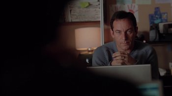 Movie still from “Friends with Money” (2006), directed by Nicole Holofcener – A man sitting in front of a computer monitor; Close Up shot, Over the shoulder angle