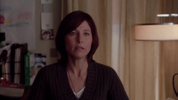 Movie still from “Friends with Money” (2006), directed by Nicole Holofcener – A person wearing a sweater; Close Up shot, Over the shoulder angle