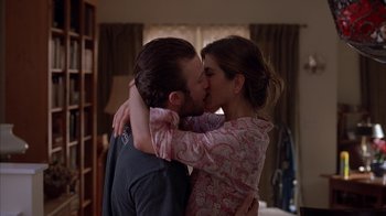 Movie still from “Friends with Money” (2006), directed by Nicole Holofcener – A man and a woman kissing each other in a room; Medium shot, Low angle