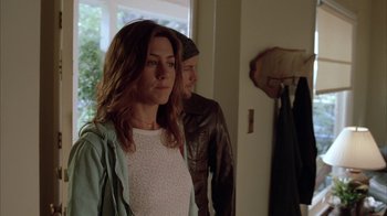 Movie still from “Friends with Money” (2006), directed by Nicole Holofcener – A woman standing next to a man in front of a window; Medium shot, Over the shoulder angle