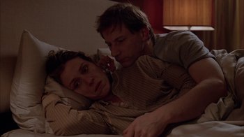 Movie still from “Friends with Money” (2006), directed by Nicole Holofcener – A man and a woman laying in bed together; Close Up shot, High angle