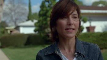 Movie still from “Friends with Money” (2006), directed by Nicole Holofcener – A person wearing a jean jacket; Close Up shot, Over the shoulder angle