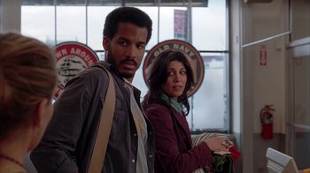 Movie still from “Friends with Money” (2006), directed by Nicole Holofcener – A man and a woman standing next to each other; Medium shot, Low angle