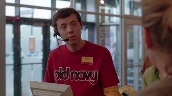 Movie still from “Friends with Money” (2006), directed by Nicole Holofcener – A man wearing a red shirt is talking into a headset; Medium shot, Low angle