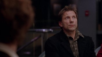 Movie still from “Friends with Money” (2006), directed by Nicole Holofcener – A man sitting in front of a mirror looking up; Close Up shot, Over the shoulder angle