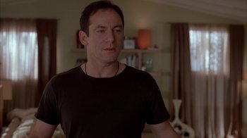 Movie still from “Friends with Money” (2006), directed by Nicole Holofcener – A person standing in a room; Close Up shot, Over the shoulder angle