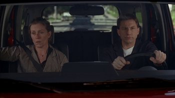 Movie still from “Friends with Money” (2006), directed by Nicole Holofcener – A man and a woman in the back seat of a car; Medium shot, High angle