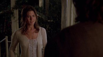 Movie still from “Friends with Money” (2006), directed by Nicole Holofcener – A woman standing in front of a man in front of a window; Medium shot, Over the shoulder angle
