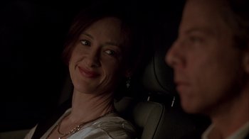 Movie still from “Friends with Money” (2006), directed by Nicole Holofcener – A woman sitting in the back seat of a car; Close Up shot, Over the shoulder angle