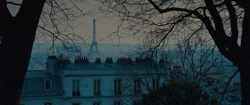 Movie still from “From Paris with Love” (2010), directed by Pierre Morel – A view of the eiffel tower from a distance; Extreme Wide shot, Low angle