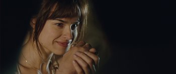 Movie still from “From Paris with Love” (2010), directed by Pierre Morel – A person with their hands clasped together; Close Up shot, Over the shoulder angle