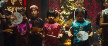 Movie still from “From Paris with Love” (2010), directed by Pierre Morel – A group of young people standing next to each other; Medium shot, Low angle