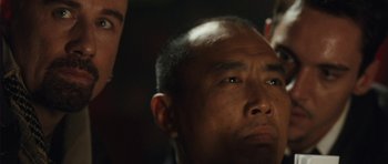 Movie still from “From Paris with Love” (2010), directed by Pierre Morel – A person looking up at the sky; Close Up shot, Over the shoulder angle