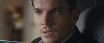 Movie still from “From Paris with Love” (2010), directed by Pierre Morel – A person with a beard; Close Up shot, Over the shoulder angle