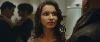 Movie still from “From Paris with Love” (2010), directed by Pierre Morel – A person with long black hair; Close Up shot, Over the shoulder angle