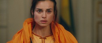 Movie still from “From Paris with Love” (2010), directed by Pierre Morel – A person wearing a yellow shirt; Close Up shot, Low angle