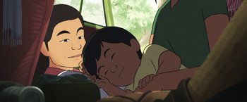 Movie still from “Funan” (2018), directed by Denis Do – An animated scene of a boy sleeping with his hands on his chest; Close Up shot, High angle