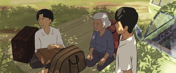 Movie still from “Funan” (2018), directed by Denis Do – An illustration of an older woman sitting on the ground; Medium shot, High angle