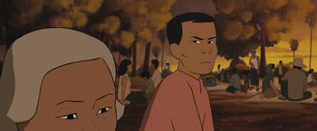 Movie still from “Funan” (2018), directed by Denis Do – An animated scene of a man and a woman in a park; Close Up shot, Over the shoulder angle