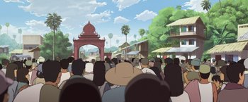 Movie still from “Funan” (2018), directed by Denis Do – A crowd of people standing in front of an archway; Extreme Wide shot, High angle