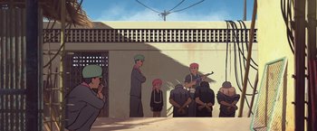 Movie still from “Funan” (2018), directed by Denis Do – A group of people standing next to each other on a street; Wide shot, High angle