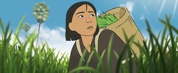 Movie still from “Funan” (2018), directed by Denis Do – An illustration of an asian woman in a field; Close Up shot, Low angle