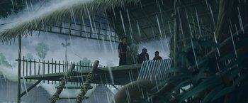 Movie still from “Funan” (2018), directed by Denis Do – A group of people standing on a dock in the rain; Wide shot, Low angle