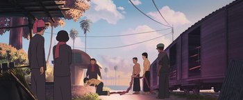 Movie still from “Funan” (2018), directed by Denis Do – A group of men standing around a building; Extreme Wide shot, Low angle