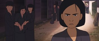 Movie still from “Funan” (2018), directed by Denis Do – An animated picture of a woman and two other people; Close Up shot, Over the shoulder angle