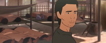 Movie still from “Funan” (2018), directed by Denis Do – A cartoon of a man with a sad look on his face; Close Up shot, Over the shoulder angle