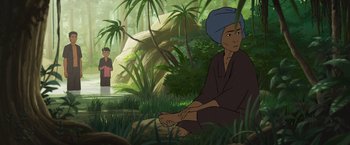 Movie still from “Funan” (2018), directed by Denis Do – An animated scene of a man sitting in the woods; Medium shot, Over the shoulder angle