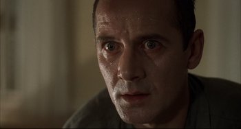 Movie still from “Funny Games” (1997), directed by Michael Haneke – A man's face with water droplets on it; Close Up shot, Low angle