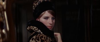 Movie still from “Funny Girl” (1968), directed by William Wyler – A woman wearing a leopard print hat and coat; Close Up shot, Over the shoulder angle