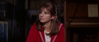 Movie still from “Funny Girl” (1968), directed by William Wyler – A woman in a red jacket looking to her left; Close Up shot, High angle