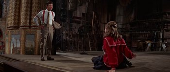 Movie still from “Funny Girl” (1968), directed by William Wyler – A man and a little girl on a stage; Medium shot, Over the shoulder angle