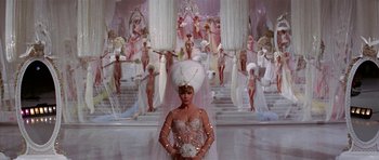 Movie still from “Funny Girl” (1968), directed by William Wyler – A woman standing in front of a group of women; Wide shot, High angle