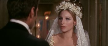 Movie still from “Funny Girl” (1968), directed by William Wyler – A woman wearing a wedding veil and a flower crown; Close Up shot, Over the shoulder angle