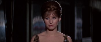 Movie still from “Funny Girl” (1968), directed by William Wyler – A person wearing a dress; Close Up shot, Over the shoulder angle