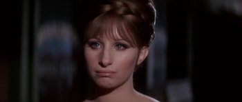 Movie still from “Funny Girl” (1968), directed by William Wyler – A person wearing a dress; Close Up shot, Over the shoulder angle