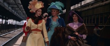 Movie still from “Funny Girl” (1968), directed by William Wyler – A group of women wearing fancy hats and fur coats; Medium shot, Low angle