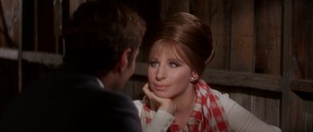 Movie still from “Funny Girl” (1968), directed by William Wyler – A man and a woman sitting in front of each other; Close Up shot, Over the shoulder angle