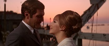 Movie still from “Funny Girl” (1968), directed by William Wyler – A man and a woman smiling at each other; Close Up shot, Low angle