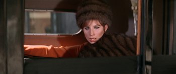 Movie still from “Funny Girl” (1968), directed by William Wyler – A woman wearing a fur coat and a fur hat; Close Up shot, Over the shoulder angle