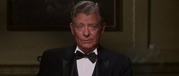 Movie still from “Funny Girl” (1968), directed by William Wyler – An older man wearing a tuxedo and a bow tie; Close Up shot, Low angle