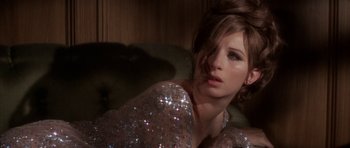 Movie still from “Funny Girl” (1968), directed by William Wyler – A beautiful young lady wearing a sequined dress; Close Up shot, Over the shoulder angle