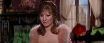 Movie still from “Funny Girl” (1968), directed by William Wyler – A person wearing a dress; Close Up shot, Over the shoulder angle